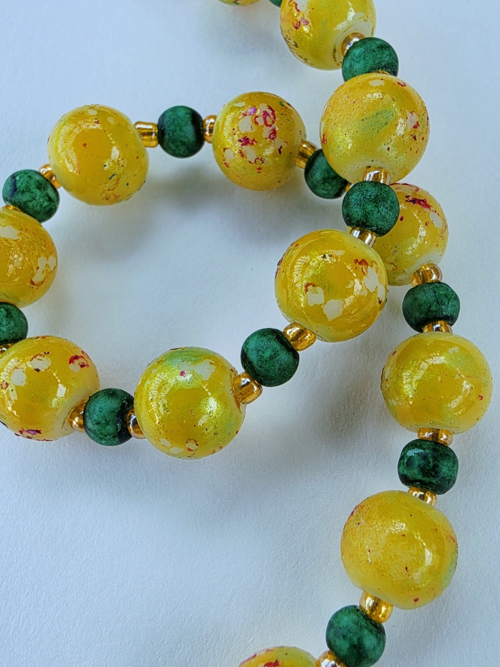 Handmade yellow and green glass beaded bracelet with gold tone toggle clasp